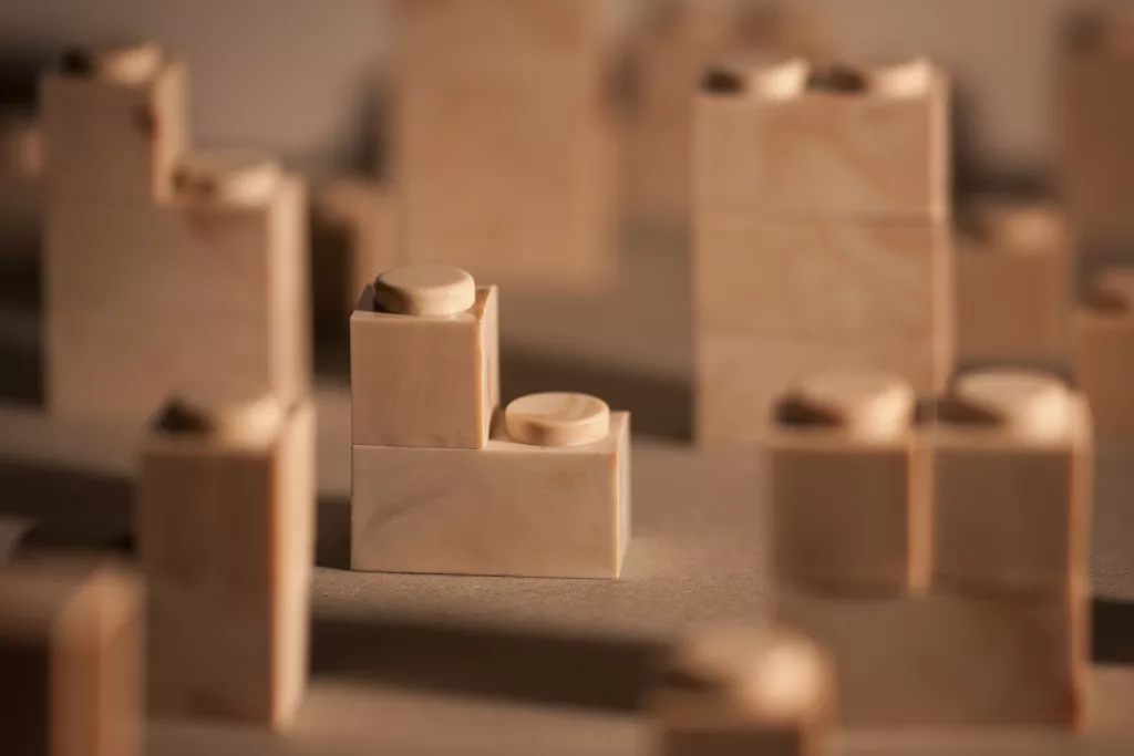 A selective focus of brown blocks depicting the blur of options for choosing a business and the need to focus on one.